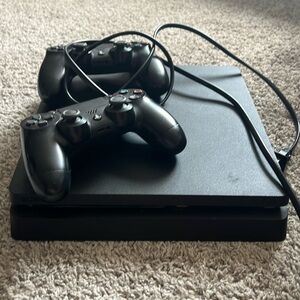 Used PlayStation 4 in great condition. Two controllers
